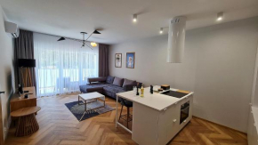 Press Apartament - salon z aneksem kuchennym, sypialnia, łazienka, taras, Pogorzelica